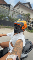 Motorcycle rider cruising through Ko Samui streets