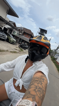 Motorcycle rider cruising through Ko Samui streets