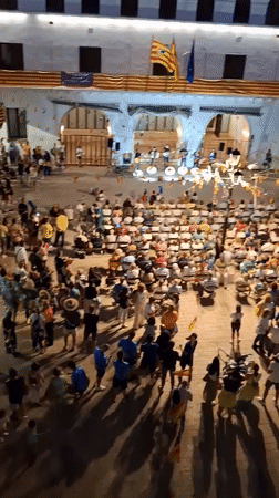 Live band plays to a packed plaza in Híjar at dusk