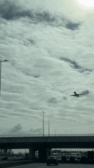 Commercial jet spotted flying over busy highway near Hoofddorp