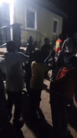 Nighttime community gathering features dancing, live drums in Nigeria