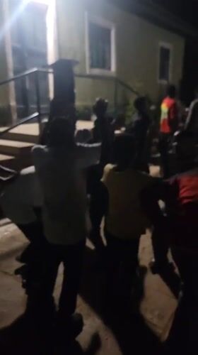 Nighttime community gathering features dancing, live drums in Nigeria