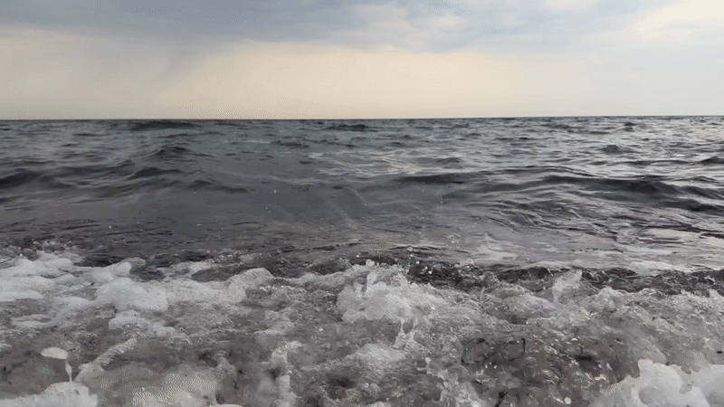 Baltic coast evening: stormy seas give way to a red sunset