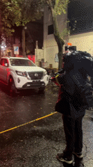 Emergency response scene documented on wet Mexico City street
