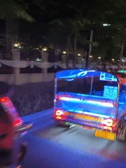 Bangkok nighttime traffic with illuminated tuk-tuks captured by witnesses