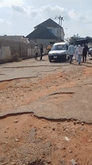 Residents navigate heavily damaged roads in Adankolo, Nigeria