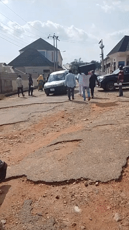 Residents navigate heavily damaged roads in Adankolo, Nigeria