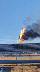 Industrial gas flares burn at Russian facility