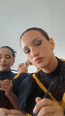 Folk dancers prepare for performance in Venezuelan beach town