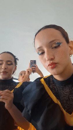 Folk dancers prepare for performance in Venezuelan beach town