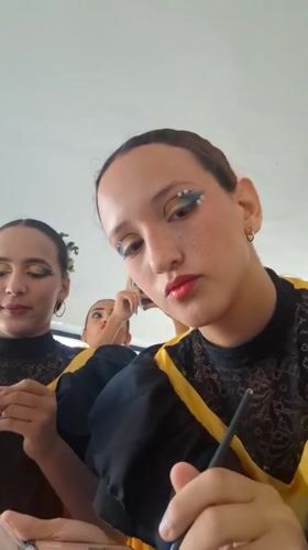 Folk dancers prepare for performance in Venezuelan beach town