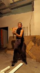 Nunchaku training in a raw unfinished space in Qarağandı