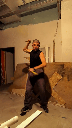 Nunchaku training in a raw unfinished space in Qarağandı