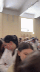 Crowd gathers in gymnasium in Perm, Russia