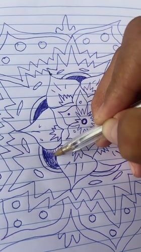 Artist creates detailed mandala drawing in Tinaquillo notebook session