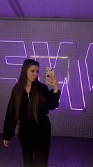 Woman records selfie videos in modern interior space, Klin Russia
