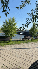 Woman documents leisurely afternoon in Votkinsk waterfront park