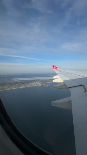 Aerial view captures Turkish coastal town from airline passenger window
