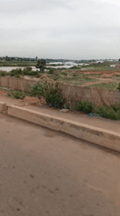 Vehicle journey captures bridge crossing and urban scenes in Nigeria