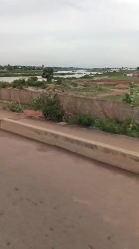 Vehicle journey captures bridge crossing and urban scenes in Nigeria