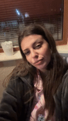 Woman takes evening selfies in Velingrad, Bulgaria