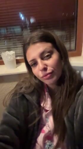 Woman takes evening selfies in Velingrad, Bulgaria