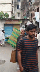 Morning crowd fills narrow Dhaka street with pedestrians