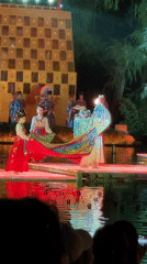 Traditional Chinese dancers perform on floating water stage in Lintong