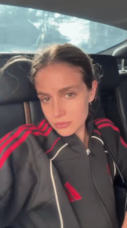 Young woman photographed in car and indoor locations