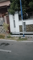 Morning street life in a Soko, Indonesia neighborhood