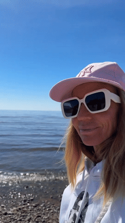 Beach visitors enjoy sunny day in Repino, Russia