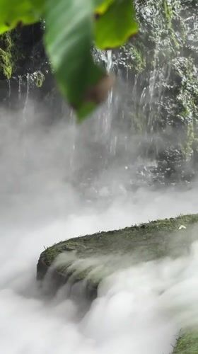 Misty garden waterfall and café at a Ban Na Chom Thian venue