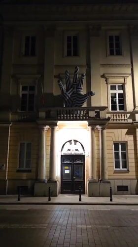 Striped hand sculpture spotted on Warsaw building facade