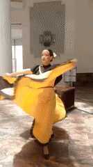 Woman in elaborate makeup dances in Venezuelan lobby