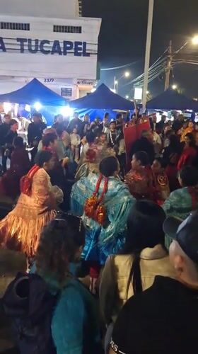 Nighttime street festival with traditional costumes in Arica, Chile