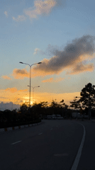 Family scooter ride, traffic captured on Mũi Né road