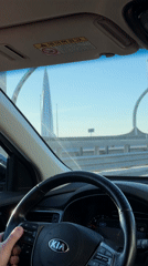 Driver spotted in Kia on sunny day in Saint Petersburg