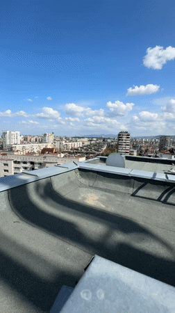 Rooftop cityscape filmed in Sofia under blue skies