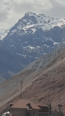 Mountain landscape filmed with truck in Tajikistan village