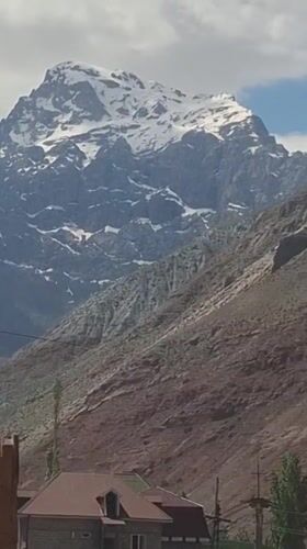 Mountain landscape filmed with truck in Tajikistan village