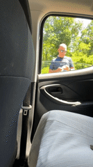 Vehicle stops at Italian toll booth, routine payment observed
