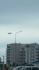 Passenger plane approaches landing over Sirius, Russia residential area