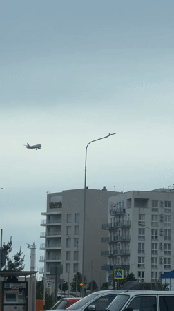 Passenger plane approaches landing over Sirius, Russia residential area