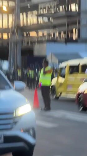 Police conduct traffic control operations at Davao City intersection