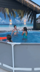 Family backyard barbecue and pool party in Russian town