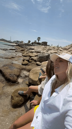 Two women enjoy sunny morning on Dhadna coastline
