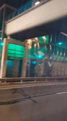 Night traffic and lit buildings along Klin streets