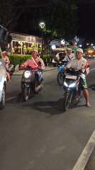 Traditional Balinese motorcycle procession observed in Denpasar evening