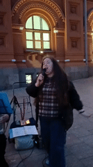 Woman performs street show in Moscow evening