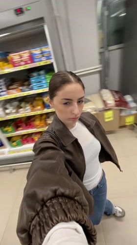 Woman shops for snacks and personal items in Moscow store